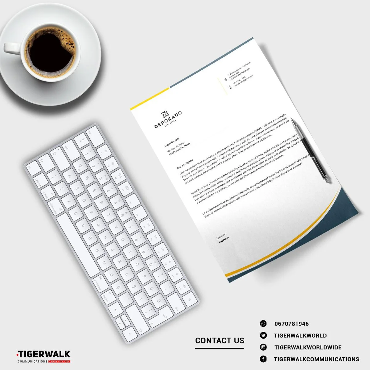 Letterhead mockup beside a keyboard, pen and coffee cup.