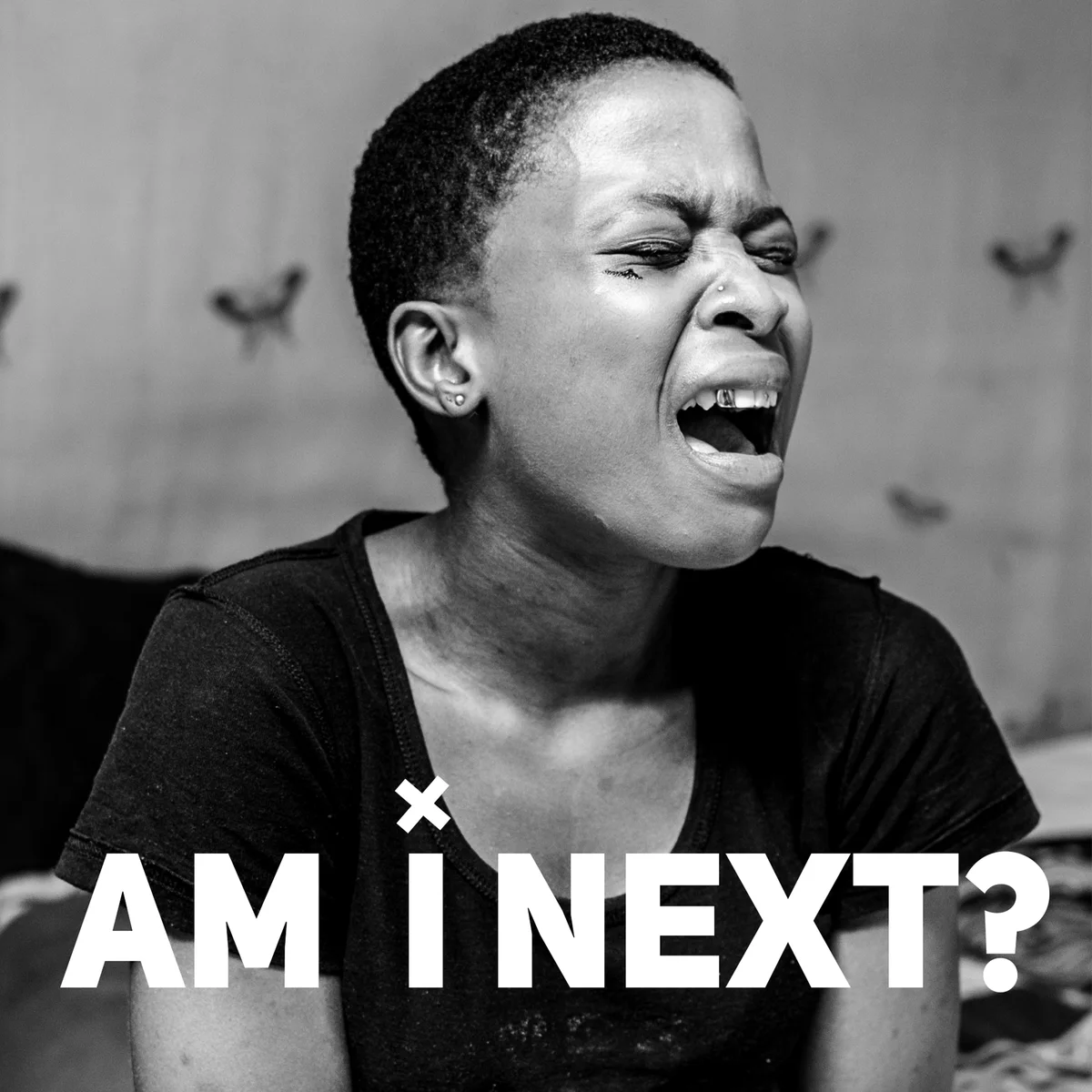 Black-and-white campaign artwork with a portrait and the question Am I Next?
